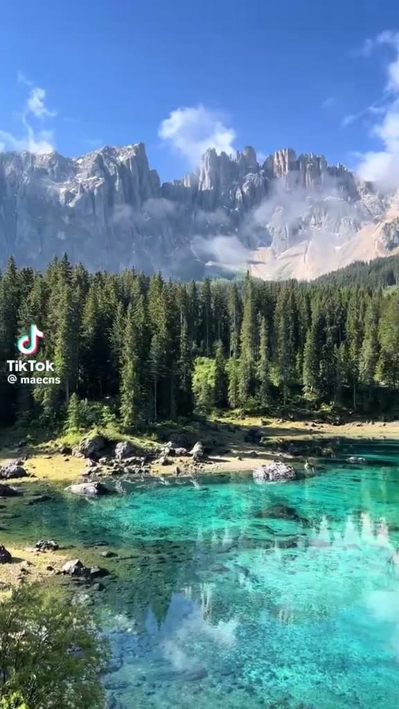 TikTok source video at 1 second showing the bouncing watermark in its initial position